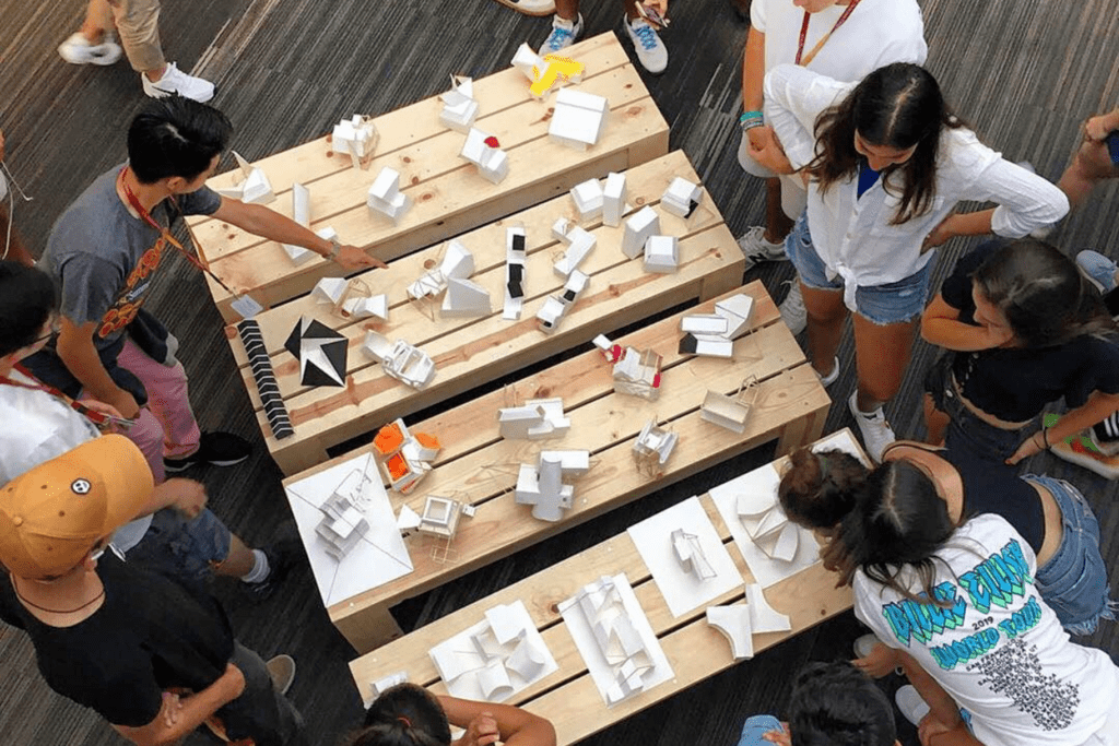 Students at the "Exploration of Architecture" summer program work on architectural models.