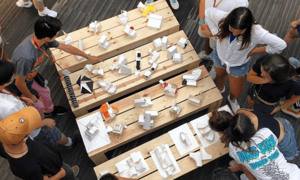 Students at the "Exploration of Architecture" summer program work on architectural models.