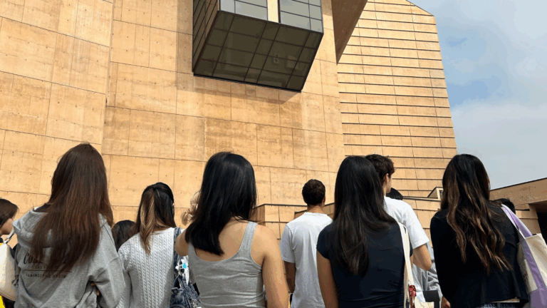 Students gaze up at the exterior of Cathedral of Our Lady of the Angels in downtown Los Angeles during an architecture walking tour.